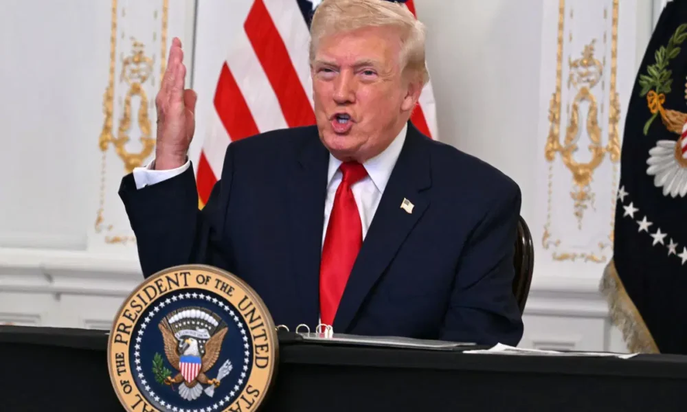 AFP 20251128 86EZ9HM v2 MidRes DonaldTrumpParticipatesInACallWithServiceMembers