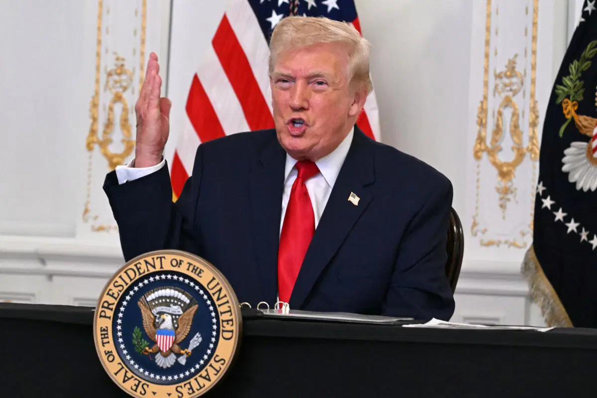 AFP 20251128 86EZ9HM v2 MidRes DonaldTrumpParticipatesInACallWithServiceMembers