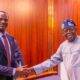 File photo of the Finance Minister Taiwo Oyedele shaking hands with President Tinubu