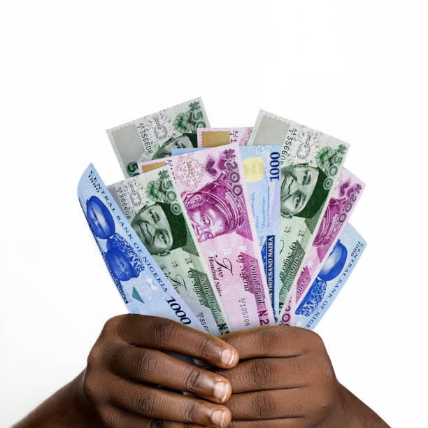 black hands holding new 3d rendered nigerian naira notes closeup of hands holding various 1