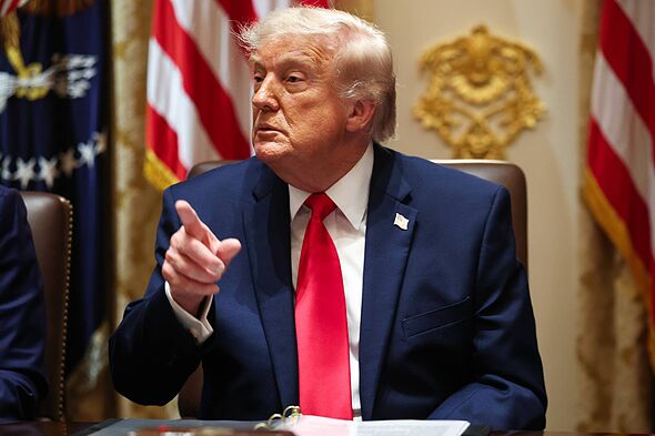 President Donald Trump takes questions from reporters during a Cabinet meeting in the Cabinet Room of the White House on May 27,