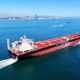 A drone photo taken on April 13 2026 shows a green fuel vessel setting sail for sea trials in Jiaozh