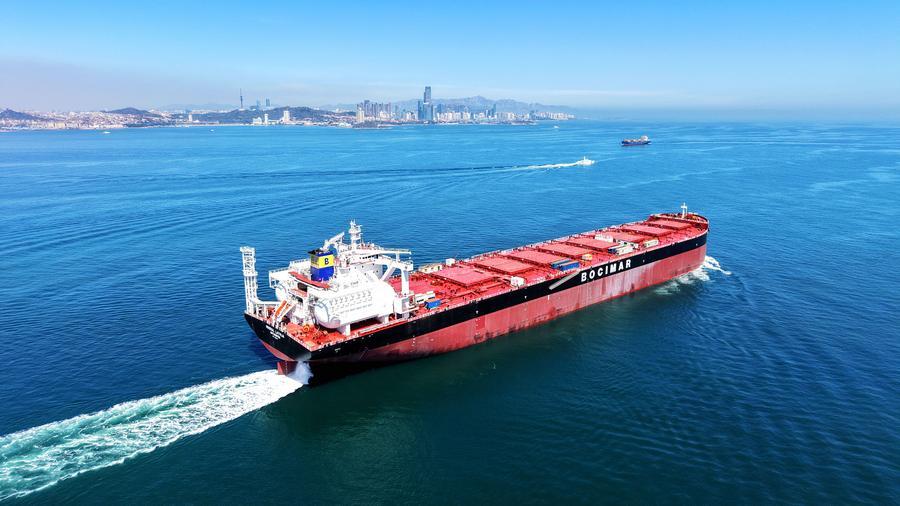 A drone photo taken on April 13 2026 shows a green fuel vessel setting sail for sea trials in Jiaozh
