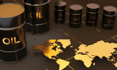 oil barrels on black background with golden world map 1788974522